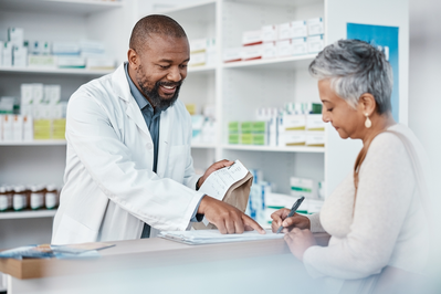 woman picking up prescription