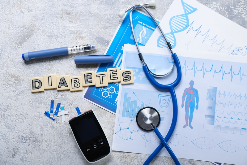 the word "DIABETES" surrounded by medical equipment and health charts